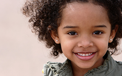 A young girl smiling