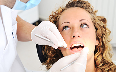 Woman sitting in a dental chair for a check-up