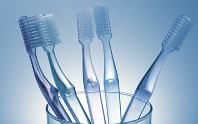 toothbrushes in a cup