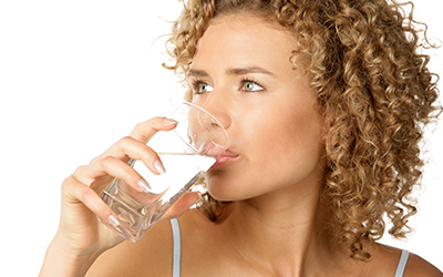 Woman drinking a glass of water